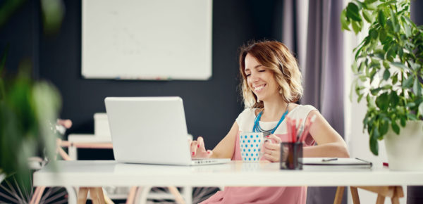 Woman at computer smiling