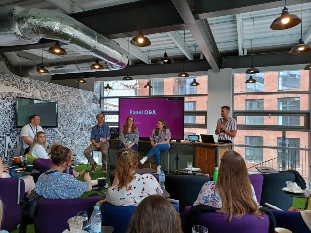 Delegates watch a presentation in our bright Manchester office