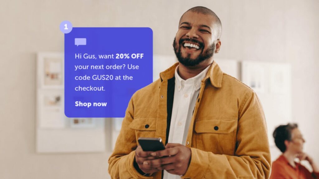 A customer receiving a discount code via SMS message on their phone