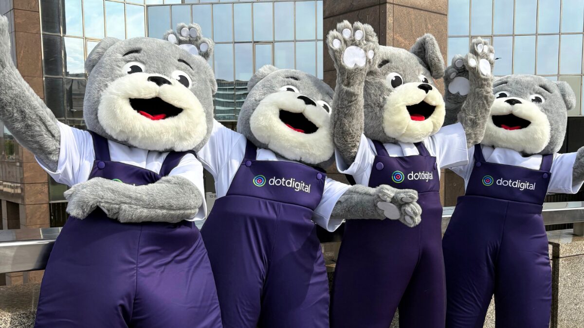 Four mascot dogs celebrating International Dog Day outside the Dotdigital offices.