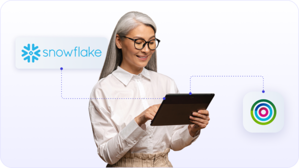 Woman working on iPad with Dotdigital and Snowflake integration to help