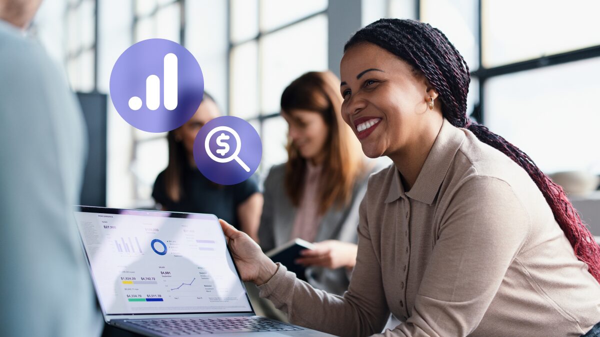 Stock image of woman smiling with data on laptop