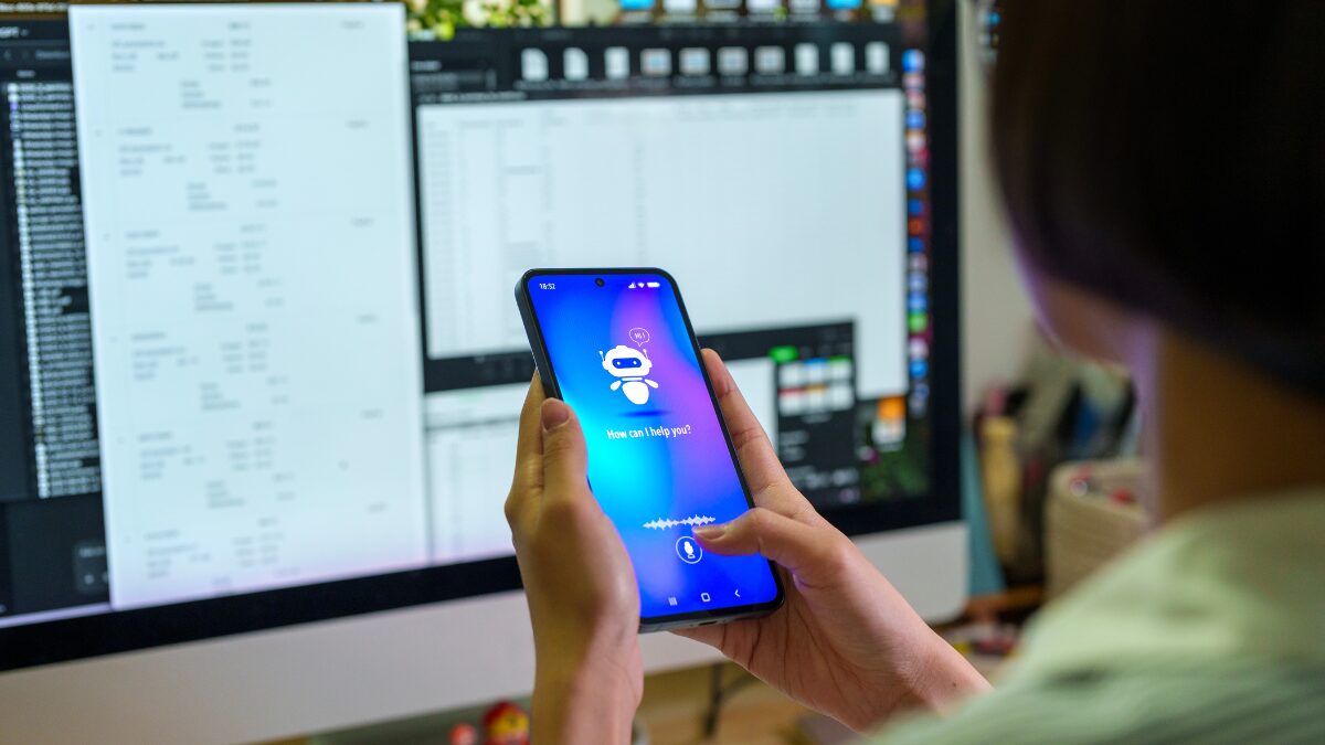 Marketer using an AI Chatbot while working stock photo