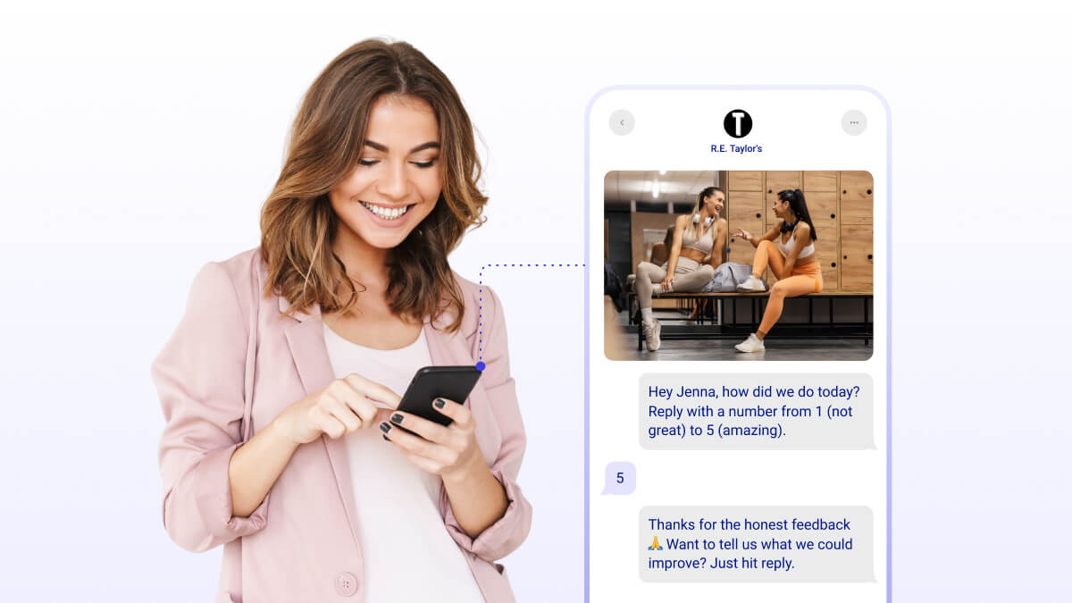 Women smiling at phone receiving two-way sms message