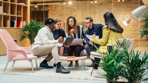 Group of marketers discussing data insights and trend