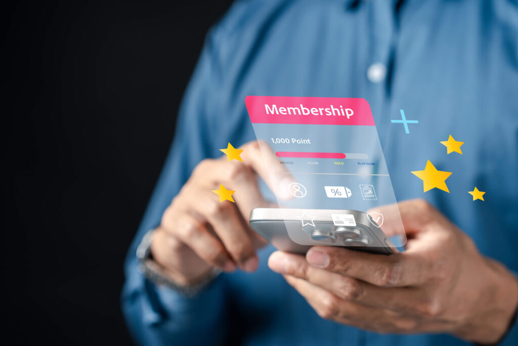 Man using smartphone app for points collection stock photo