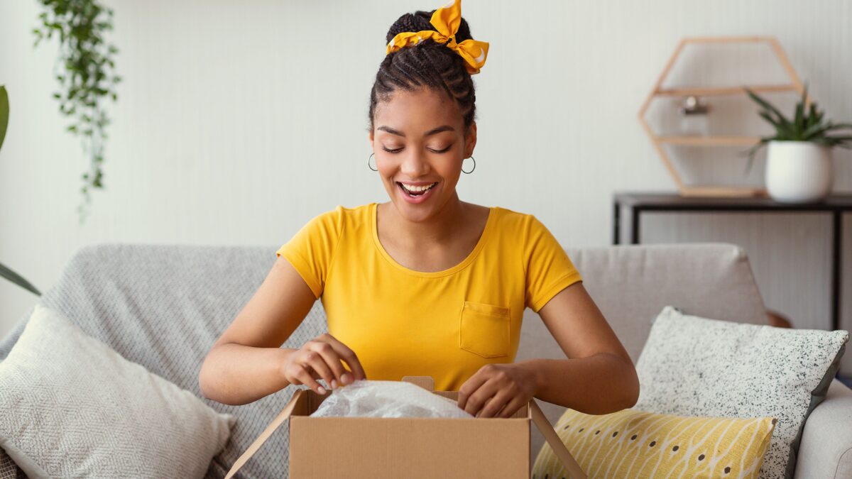 Happy customer opening package delivery shopping